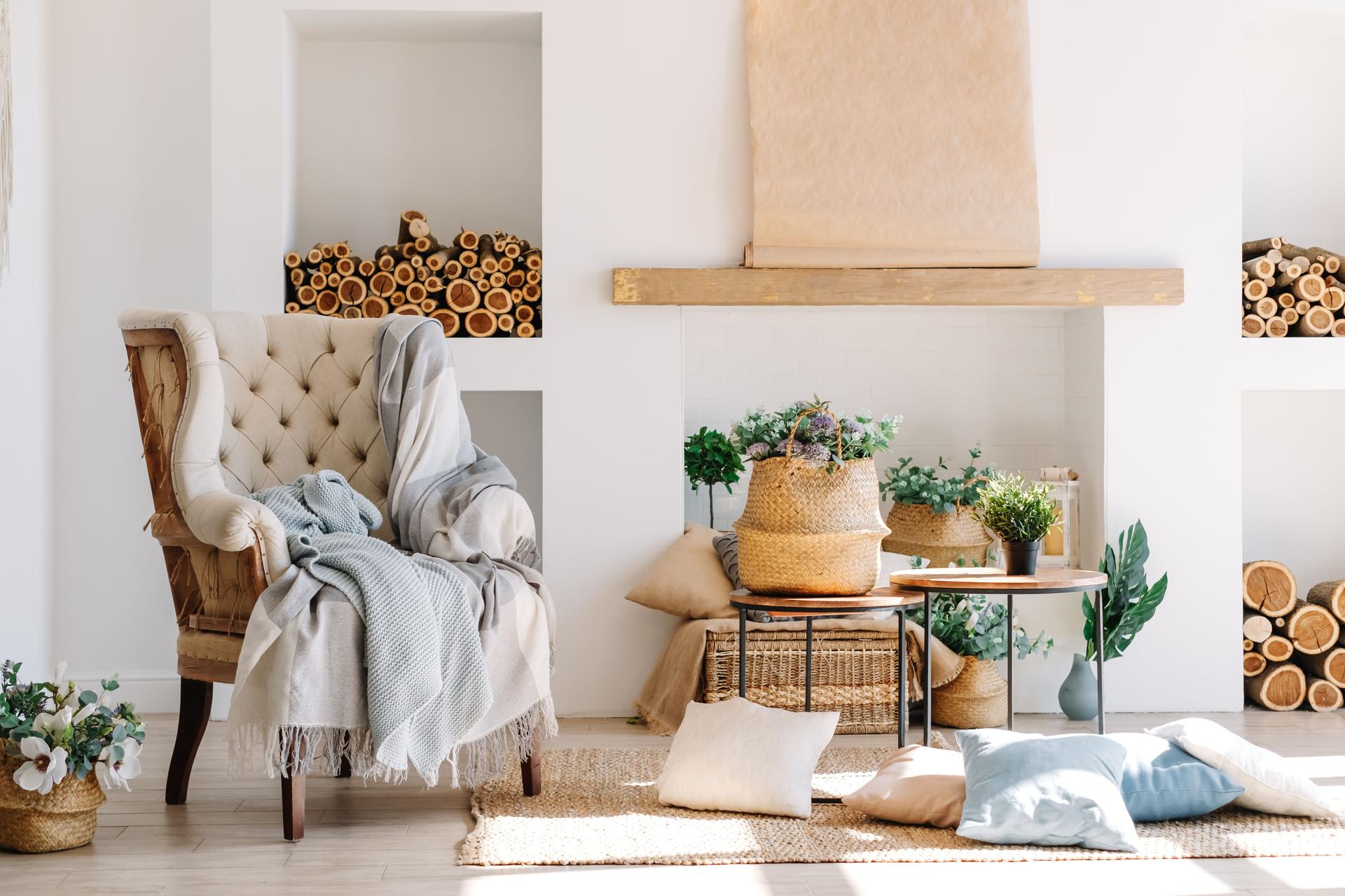 Comfy living room with a chair, fireplace cove, and wood stacks